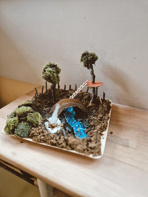 A miniature moss-and-bridge diorama